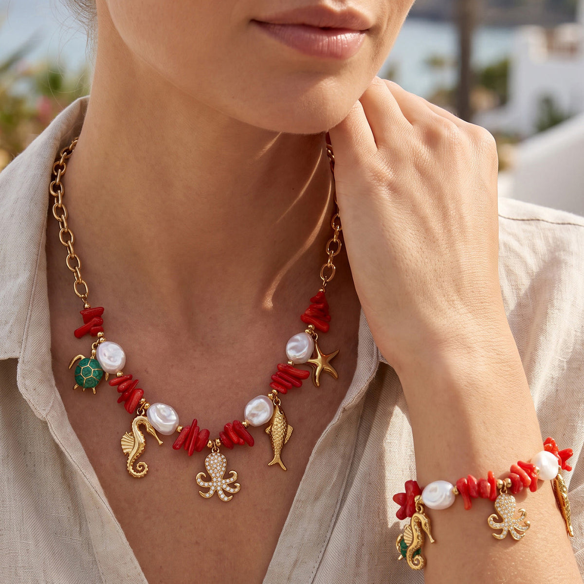 Sea life charm necklace and bracelet with turtle, fish and red bead accents