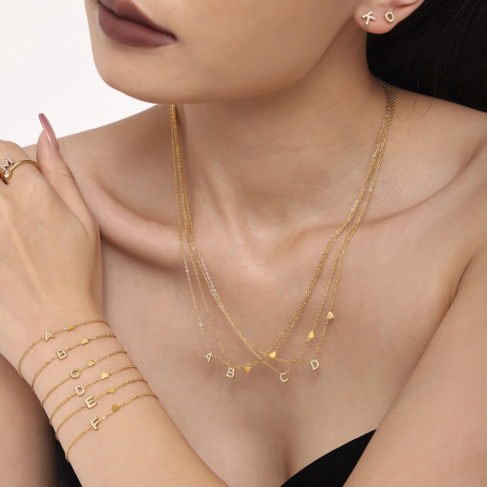 316L stainless steel 18K Gold PVD Plated Initial Zircon Jewelry Set modeled styling view for wholesale jewelry set buyers