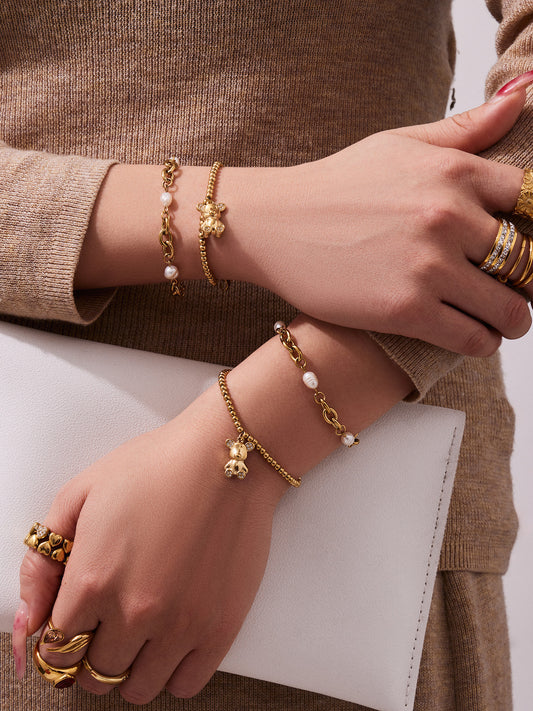Model wearing 316L stainless steel 18K gold PVD zircon bear bracelet, waterproof everyday wear jewelry