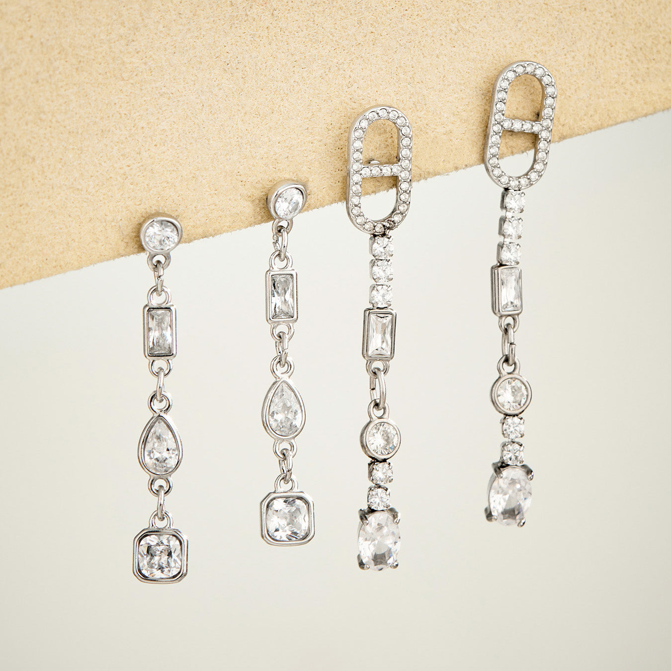 Steel-tone cubic zirconia long drop earrings in multiple geometric styles