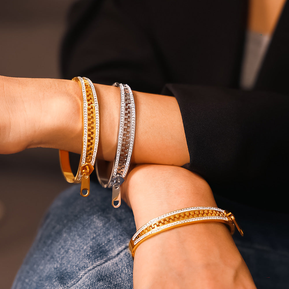 18k pvd gold and stainless steel zipper rhinestone bangle, model wearing on wrist