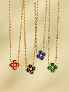 Gold tone colorful clover zircon necklace hanging product photo for jewelry buyers