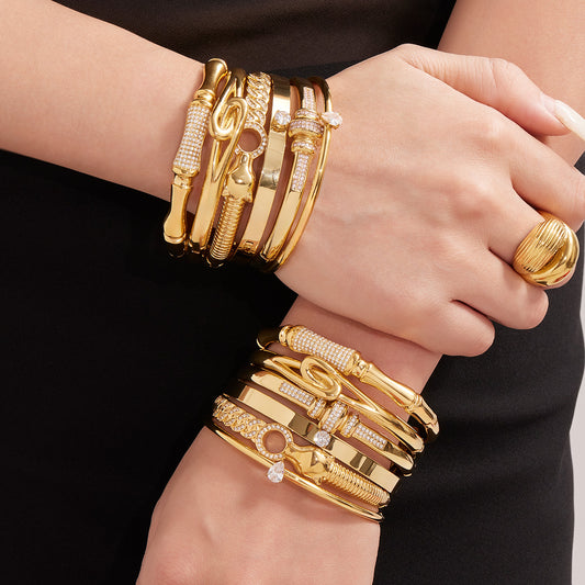 model wearing 18k gold 5a zircon bamboo bracelet set, layered european american style jewelry