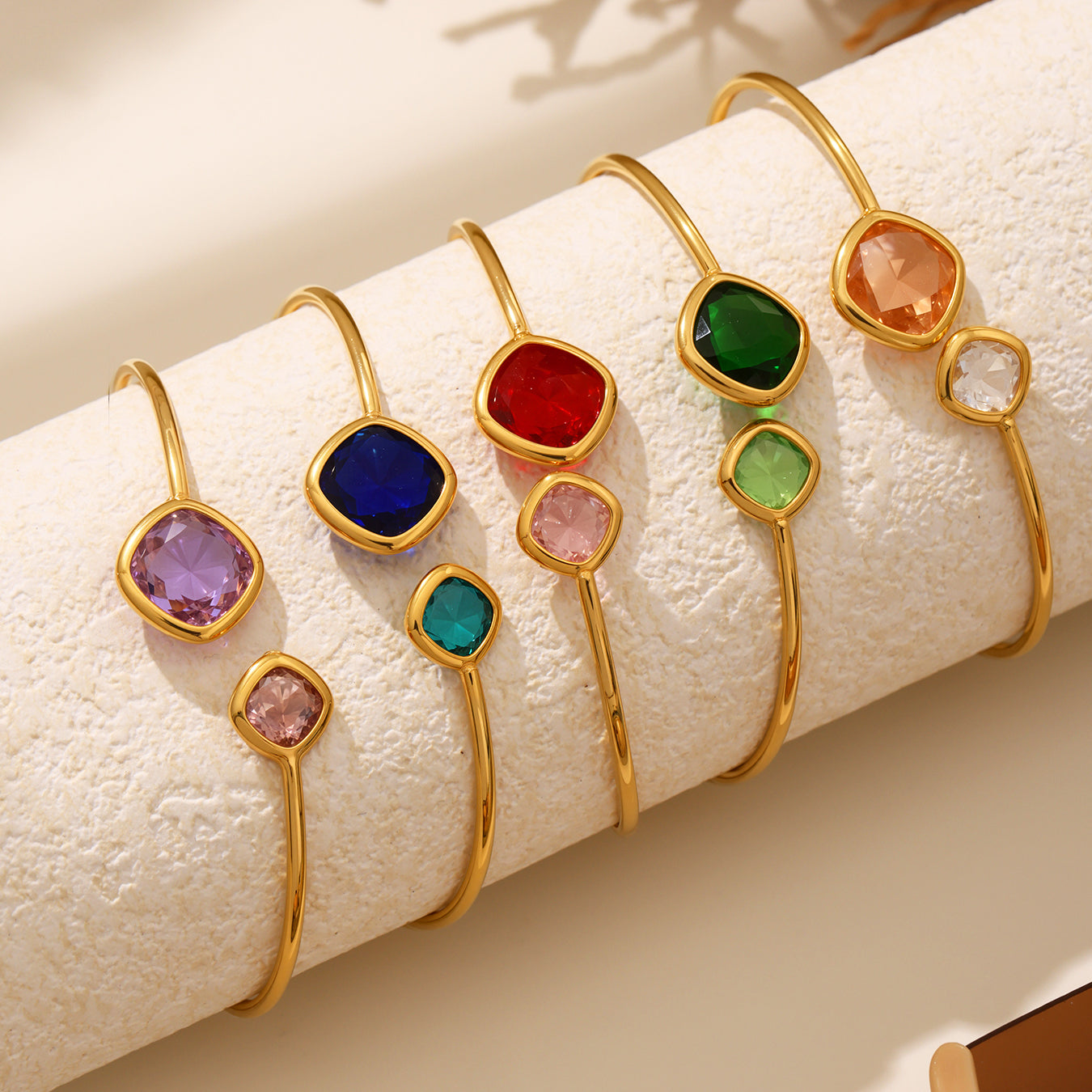 18k gold plated Czech glass stone open bangle set displayed on fabric, colorful light luxury jewelry