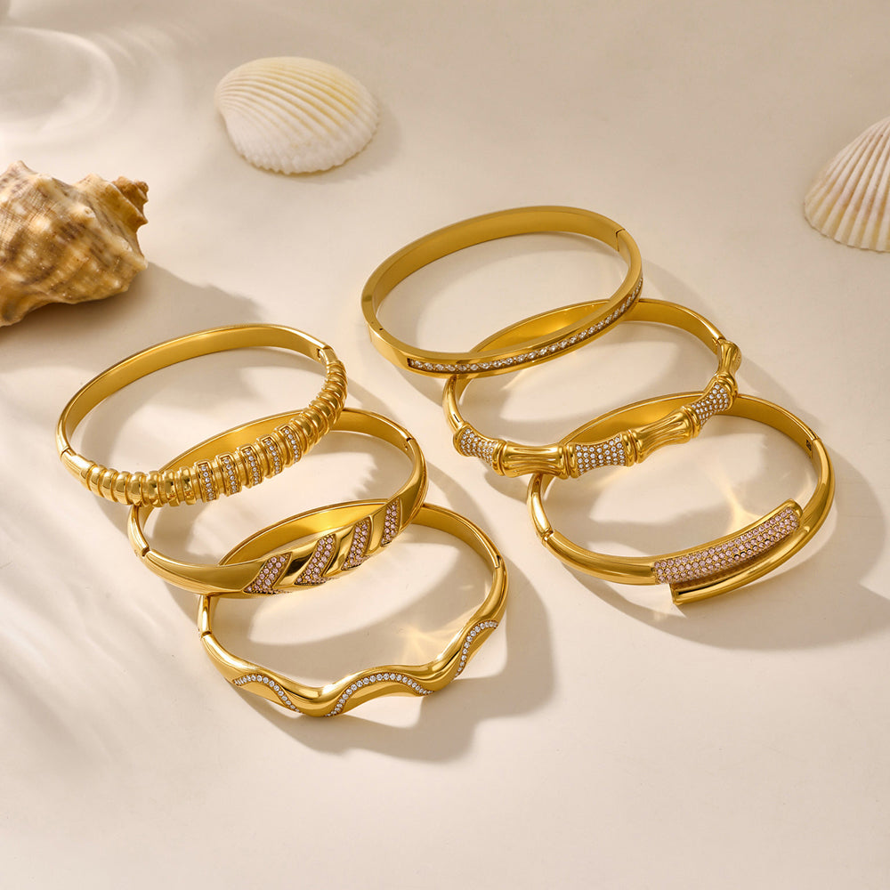 18K gold plated geometric bamboo joint zircon bracelets displayed with seashells