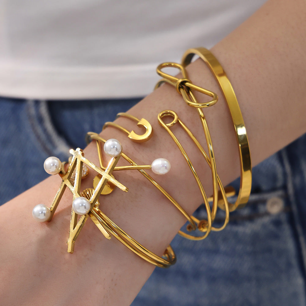 Model wearing stacked 18K gold geometric line & pearl open bangles, trendy INS style jewelry