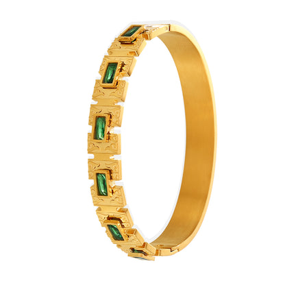 18K gold-plated green zircon clasp bangle on white background, minimalist luxury design