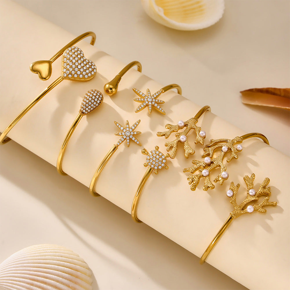 18k gold plated 5A zircon heart star bangle set, stacked on light background