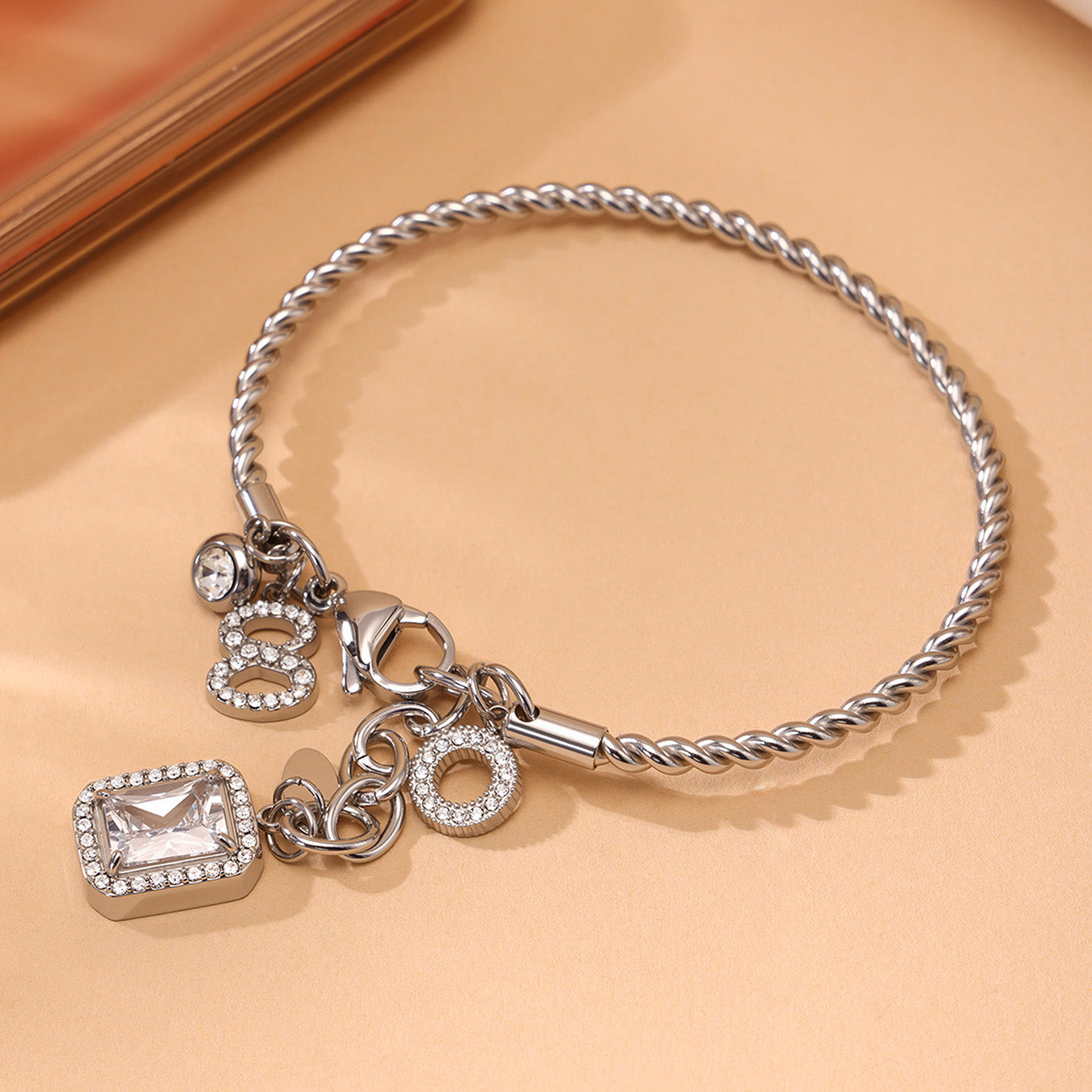 Closeup of silver 18k gold plated 5A zircon twist DIY bangle: durable 18k gold plating