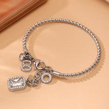 Closeup of silver 18k gold plated 5A zircon twist DIY bangle: durable 18k gold plating