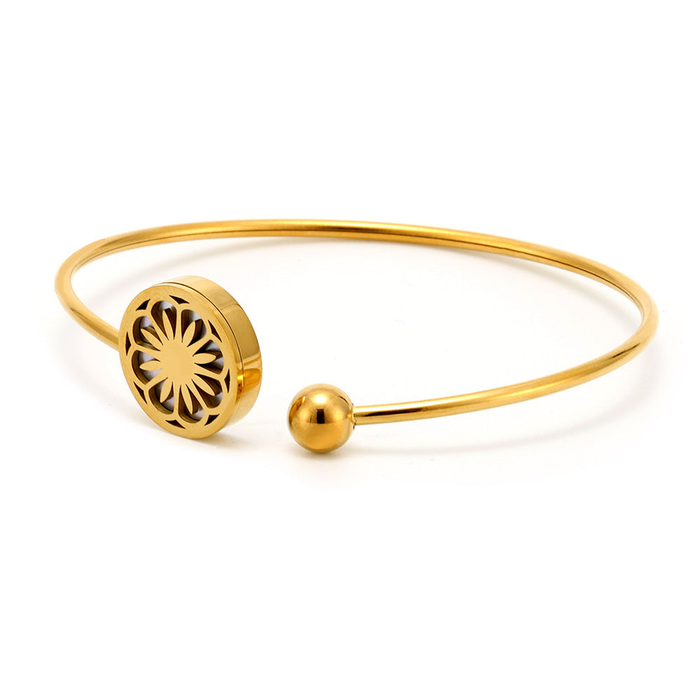 18k gold plated daisy sea shell stretch bangle on white background