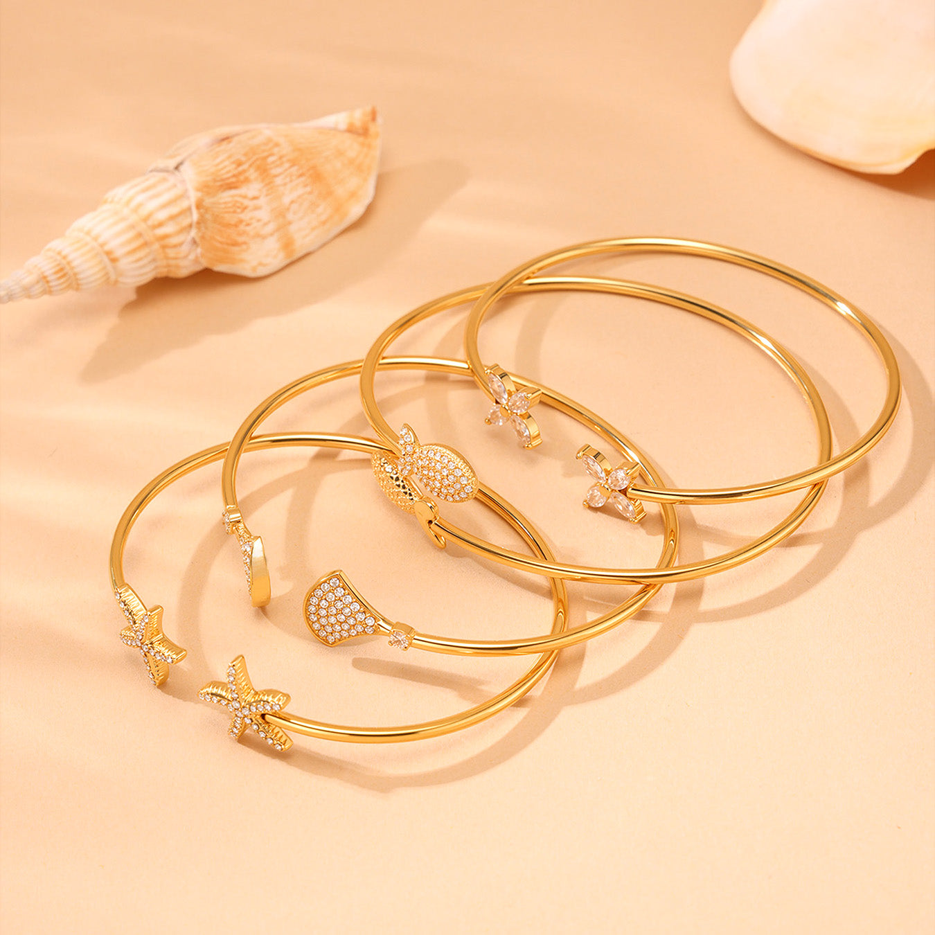 18k gold plated ocean 5A zircon bangle set: fish starfish design stacked on beach scene