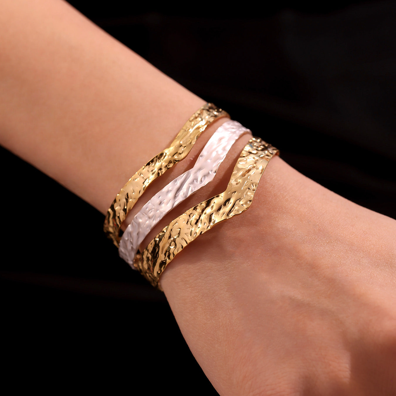 Single 18k gold plated oil drop color block open bangle on wrist, minimalist hammered arm cuff