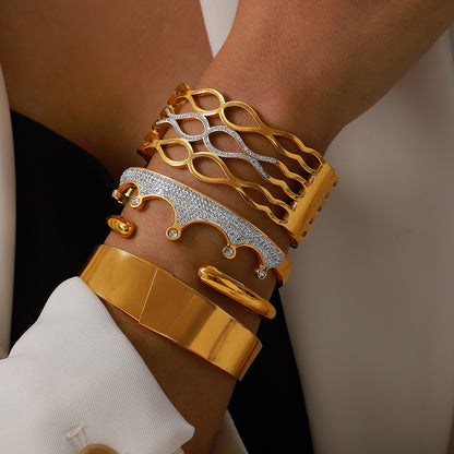Side view of 18k gold plated rhinestone bangle set on wrist, elegant stacked bracelet for outfit