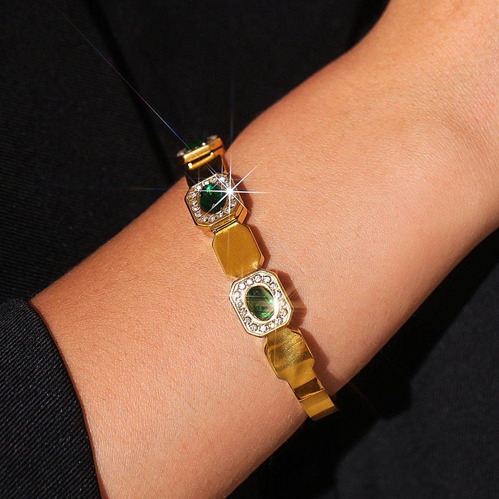 Woman wearing 18K gold plated square green zircon clasp bangle, personalized luxury versatile jewelry