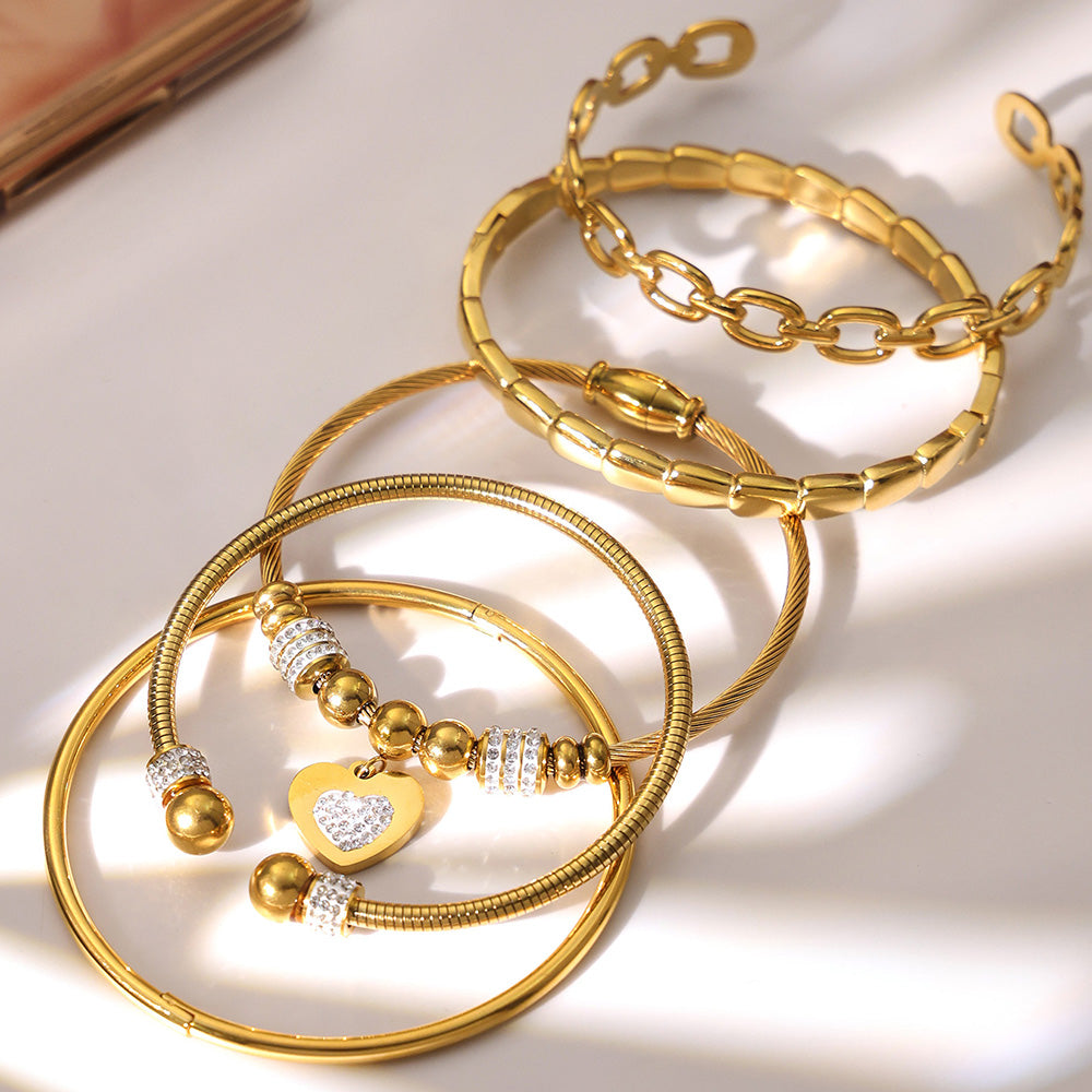 Closeup of 18k gold plated thin open bangle set: fade-resistant design