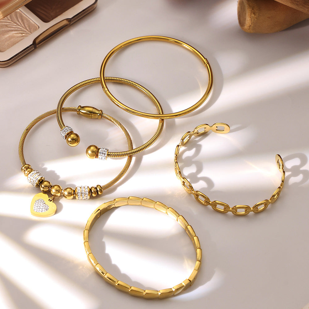18k gold plated thin open bangle set displayed on light background