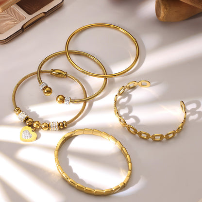 18k gold plated thin open bangle set displayed on light background