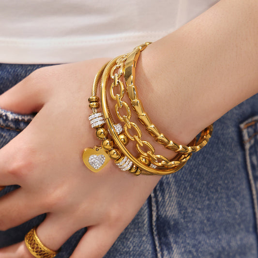 Model wearing gold 18k gold plated thin open bangle set: high-quality minimalist style