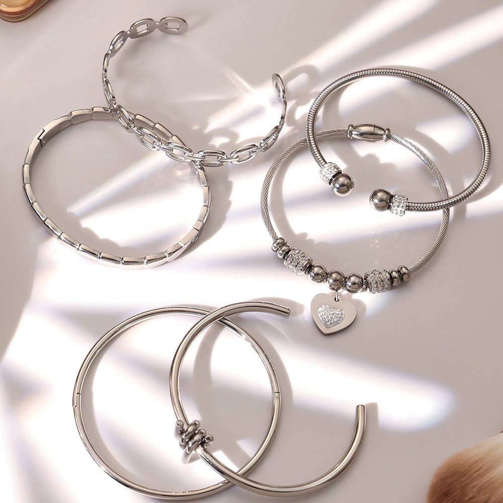 Silver 18k gold plated thin open bangle set displayed on light background