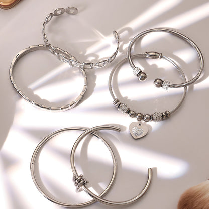 Silver 18k gold plated thin open bangle set displayed on light background