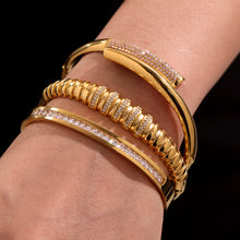Close-up of 18K gold plated geometric bamboo zircon bracelets on wrist