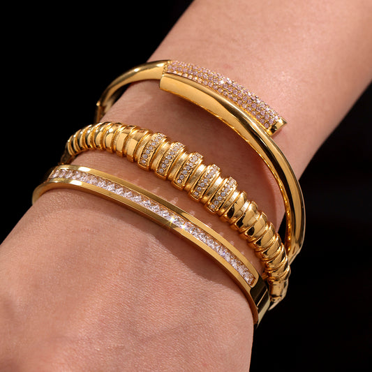 Close-up of 18K gold plated geometric bamboo zircon bracelets on wrist