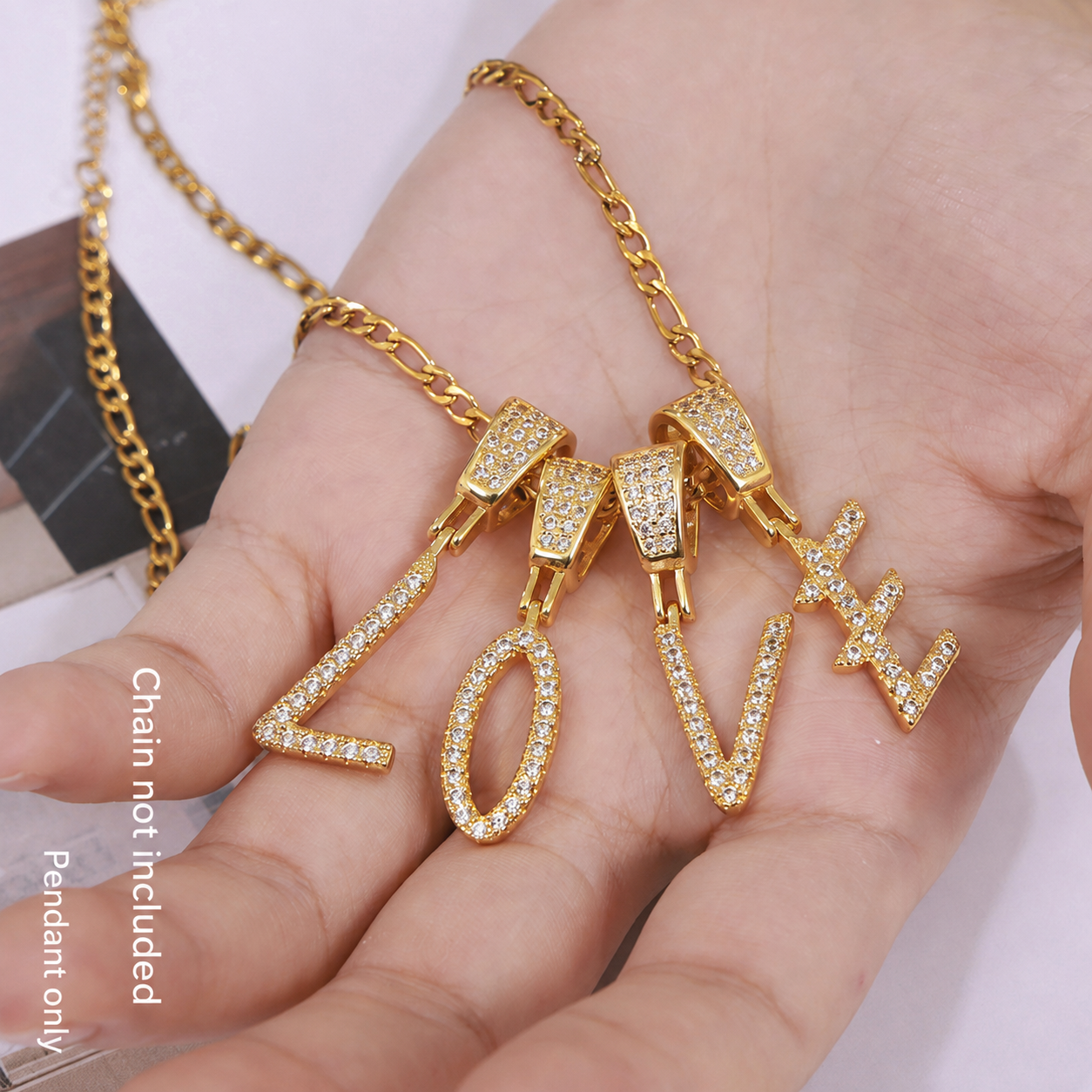 18K gold plated zircon LOVE letter pendant charms displayed on hand, sparkling initial jewelry charms for personalized necklaces