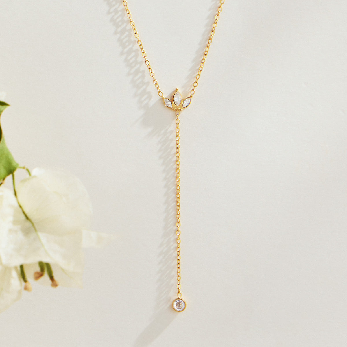 18K gold PVD Y lariat necklace with zircon drop detail on white background