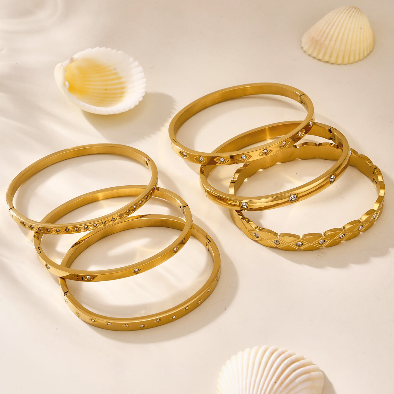 18k gold titanium steel zircon bangles displayed loosely, trendy minimalist women's jewelry