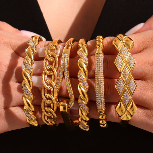 Hands holding 18K gold plated stainless steel zircon bangle set, European fashion jewelry