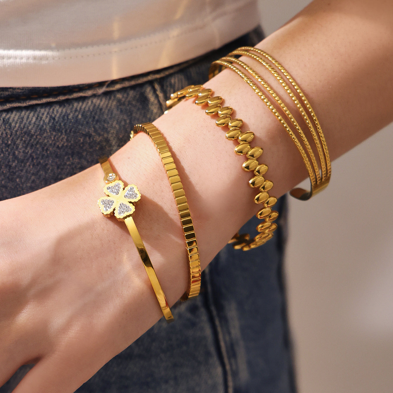 Model wearing stacked 18K gold zircon clasp bangle set, trendy INS style jewelry