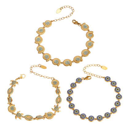 18K PVD gold evil eye ocean bracelet with blue zircon accents worn on wrist for resort jewelry wholesale buyers