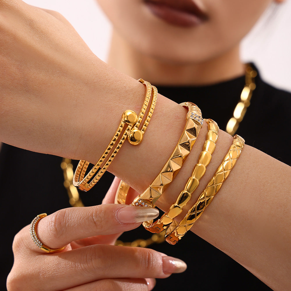 Woman wearing 18K real gold PVD plated luxury bangle set, trendy fashion bracelet jewelry