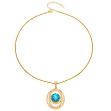 Blue faceted glass double-halo pendant necklace in 18K gold-plated 316 stainless steel on a white background