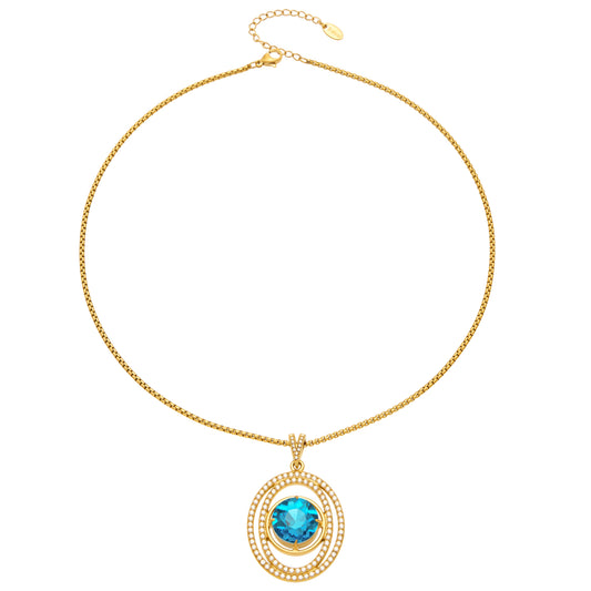 Blue faceted glass double-halo pendant necklace in 18K gold-plated 316 stainless steel on a white background