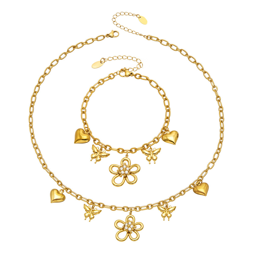 316L stainless steel floral butterfly charm necklace and matching bracelet in an 18K PVD gold finish