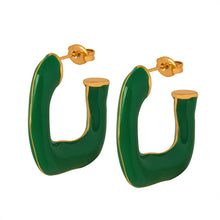 Close-up of green enamel droplet detail on 316L stainless steel earrings
