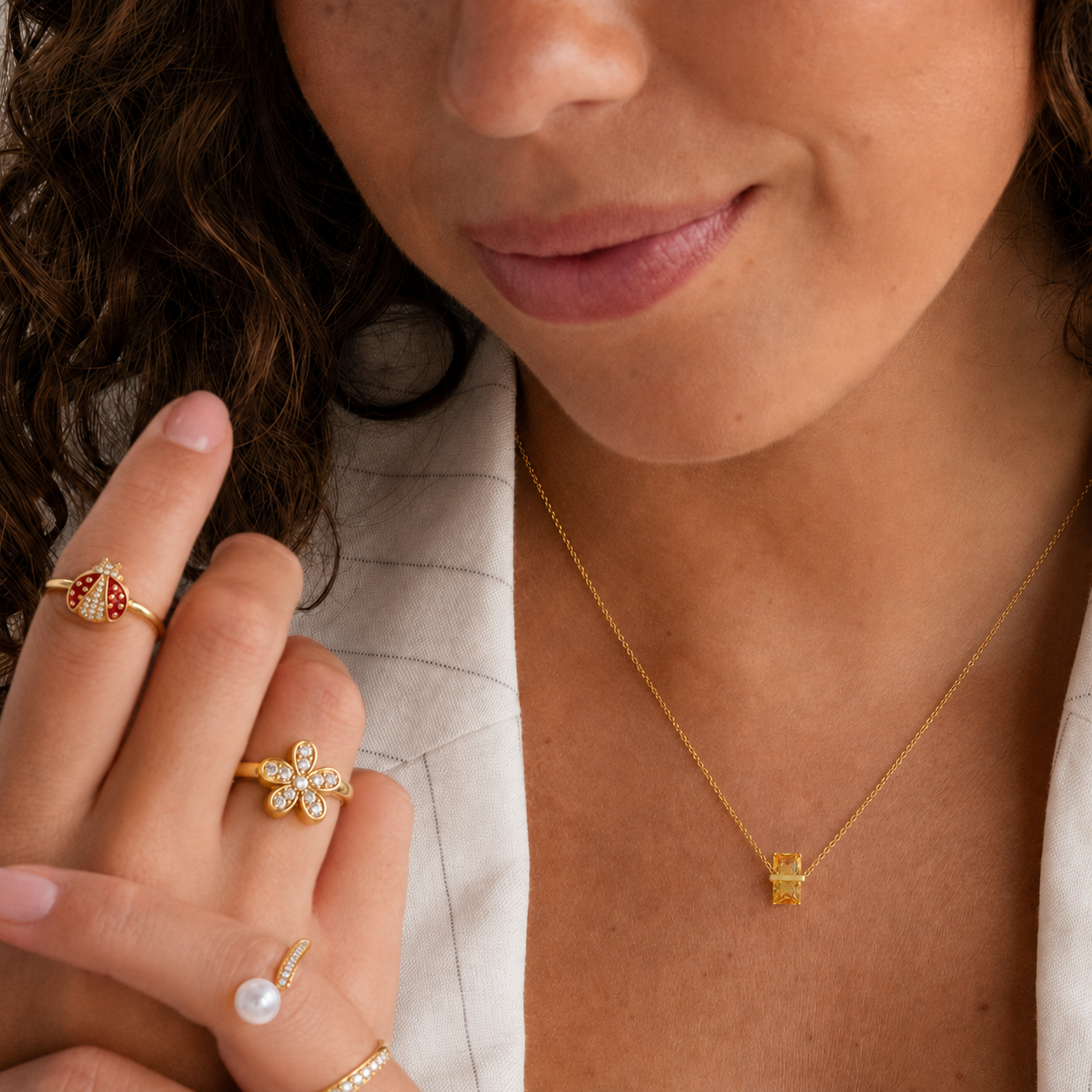 Close-up of a 316L stainless steel 12-color birthstone crystal pendant necklace featuring a light yellow baguette crystal pendant.