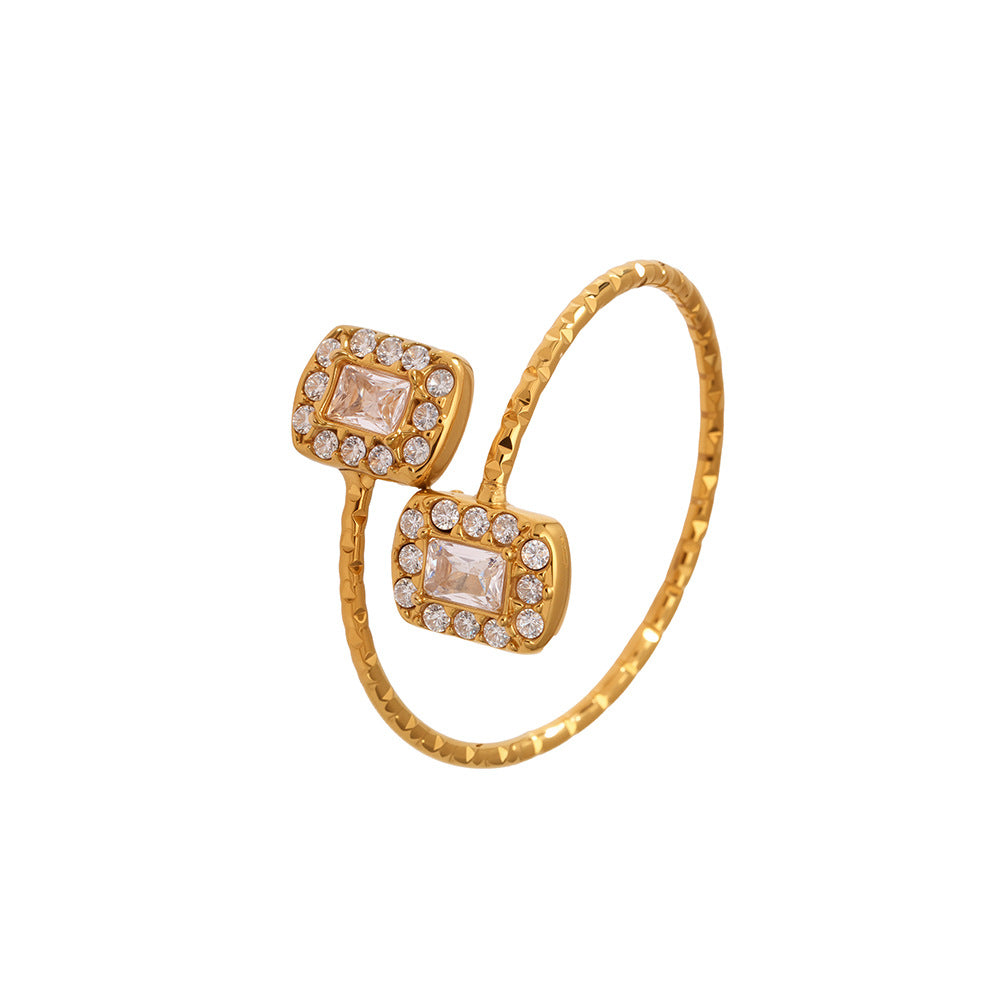 This 316L stainless steel adjustable open ring features a geometric design with 18K gold plating and brilliant 5A zircon rectangle stones. Waterproof, tarnish-resistant, and hypoallergenic, perfect for statement ring collections and everyday wear.