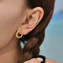 Model showcasing tarnish-free 316L stainless steel natural stone beaded hoop hypoallergenic earrings.