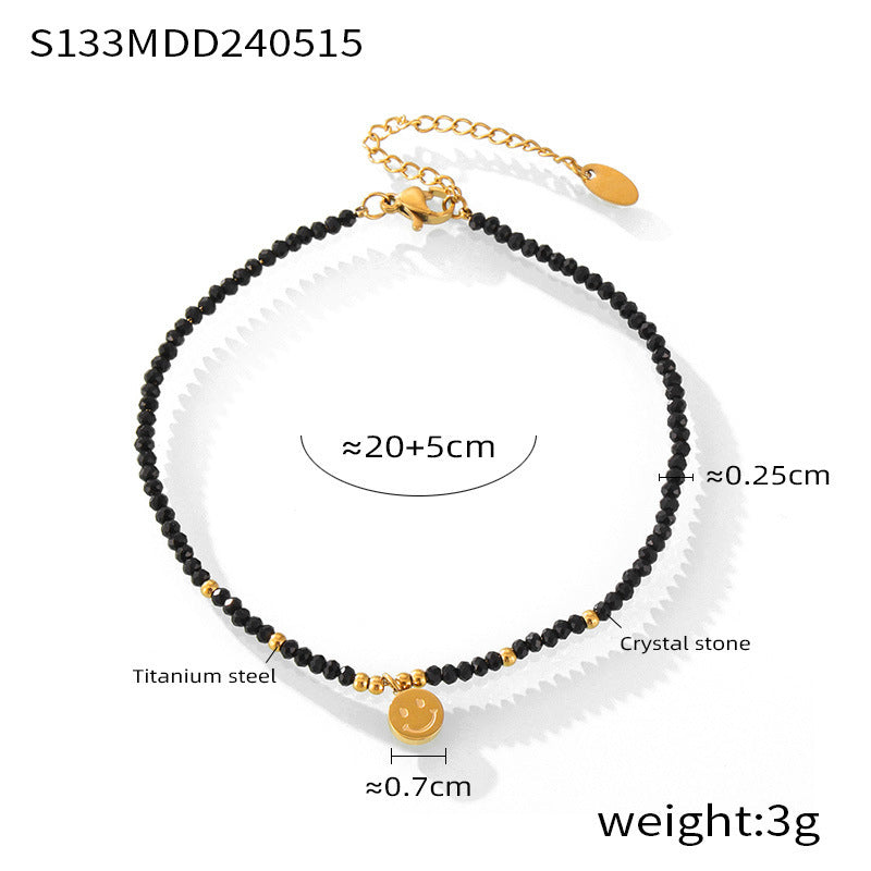 Black beaded anklet with gold charm accent on white background, minimalist waterproof anklet for wholesale summer displays