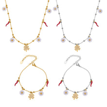 A beautiful 316L stainless steel jewelry collection featuring enamel white daisy and clover necklaces and bracelets in gold and silver tones.