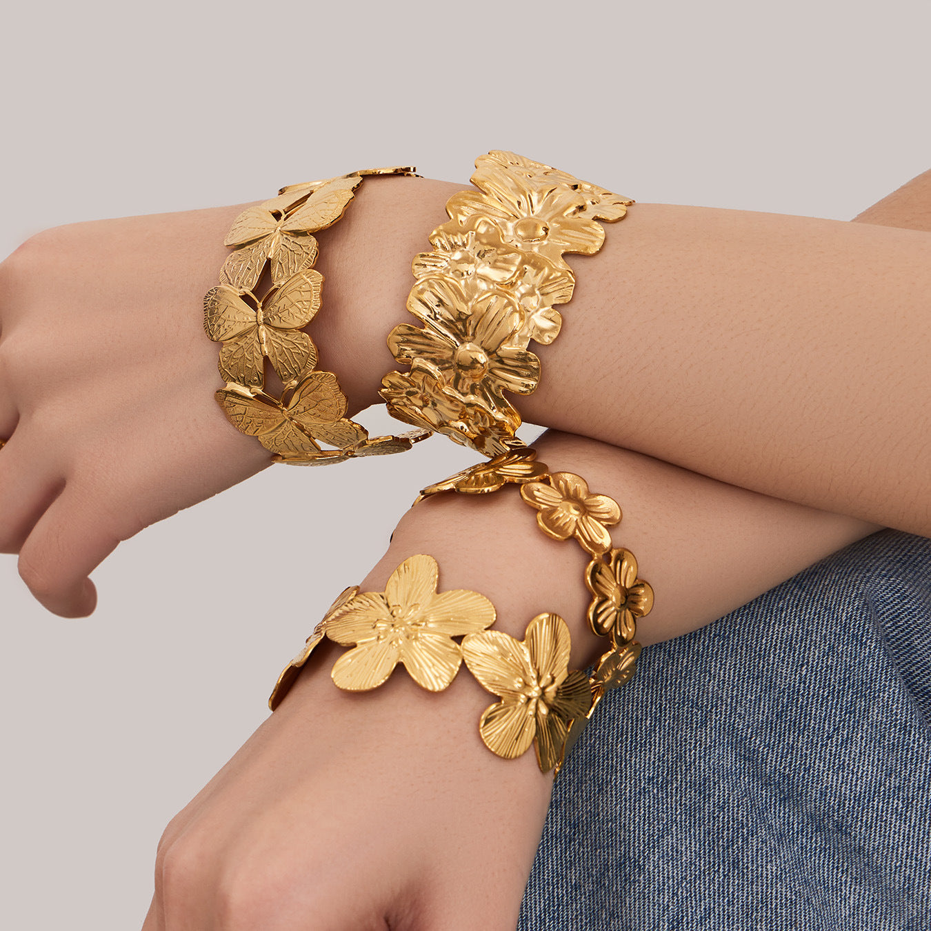 316L stainless steel 18K Gold Plated Filigree Floral Butterfly Open Bangle modeled styling view for wholesale bangle buyers