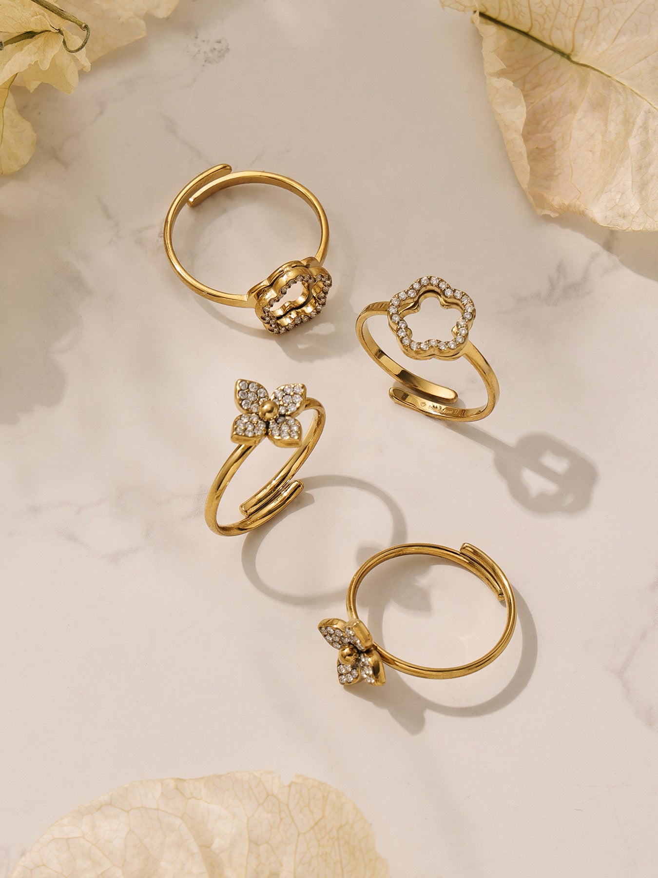 Close-up view of the zircon flower ring and gold hoop earrings designed for long-lasting brilliance and comfort.