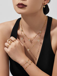 Close up of a delicate 18K gold plated geometric necklace featuring sparkling zircon stones for daily elegance.