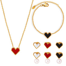 A 316L stainless steel French heart jewelry set featuring gold necklaces, bracelets, and pearl earrings with various colorful inlays.