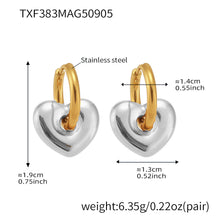 Size and weight details for the two-tone heart hoop earrings featuring a silver hoop and gold heart charm.