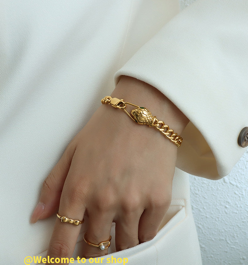 316L Stainless Steel snake head bracelet on model, 18K gold PVD finish, edgy minimalist style