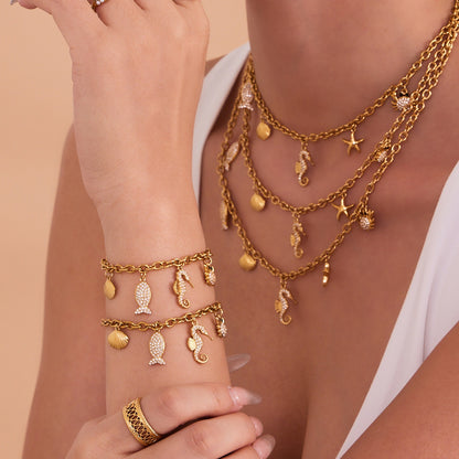 316L Stainless Steel 18K Gold Plated Sparkling Seahorse & Fish Multi-Charm Necklace & Bracelet Set - Image 3